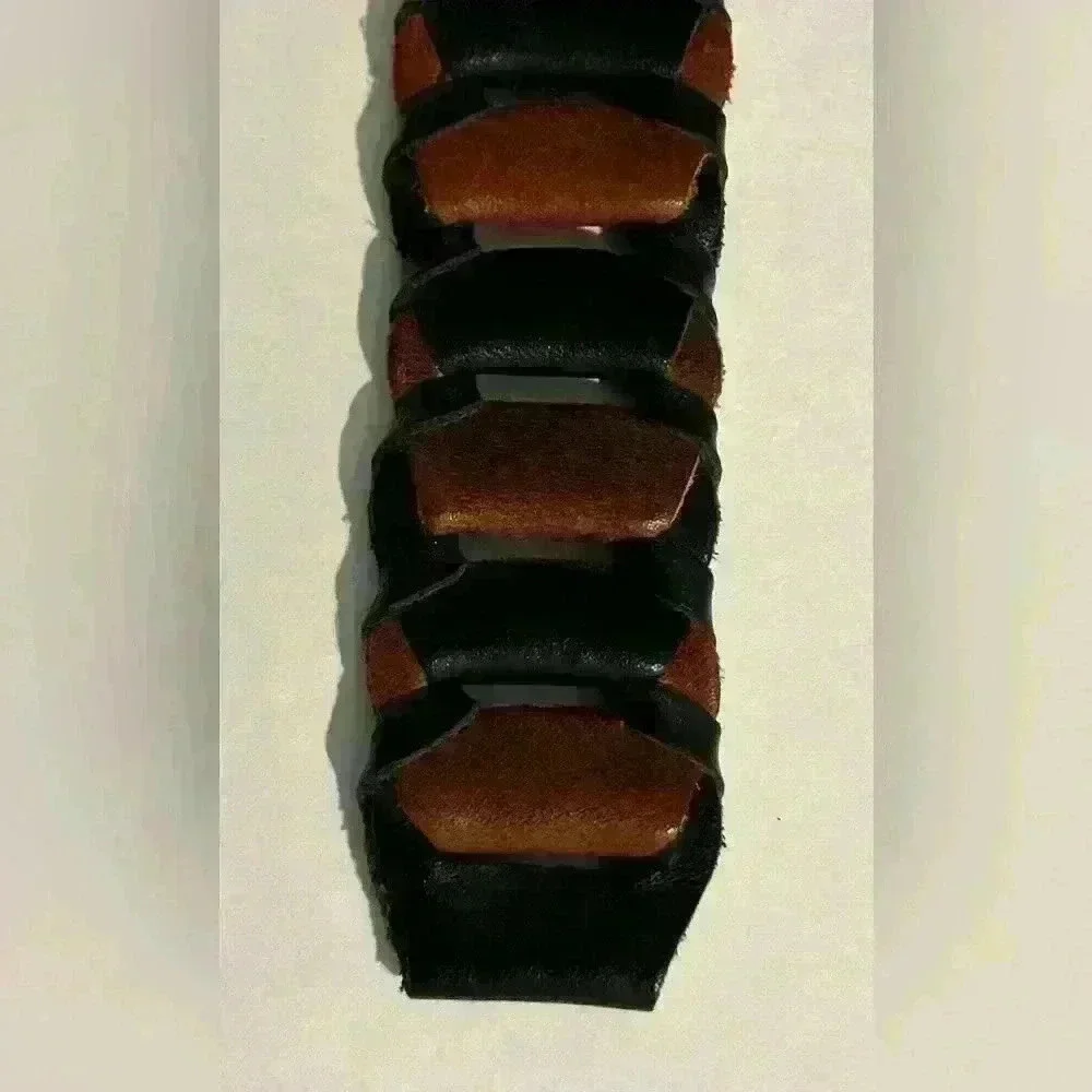 A men’s braided link dress belt with a brass buckle.